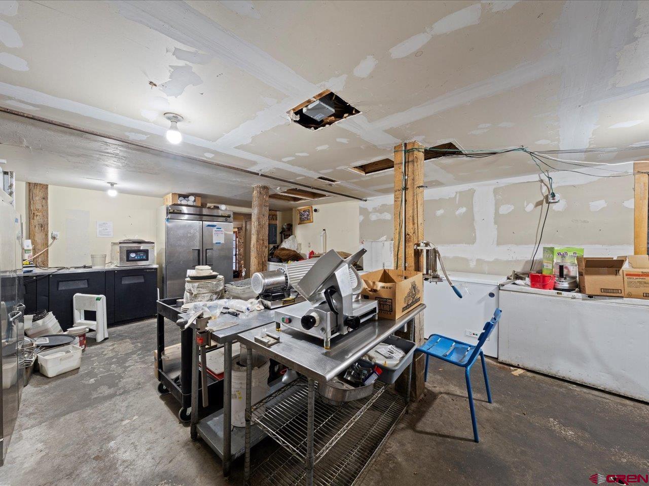 726 Main Street Ouray, CO 81427 - Photo 14 of 41 a living room with furniture and a flat screen tv