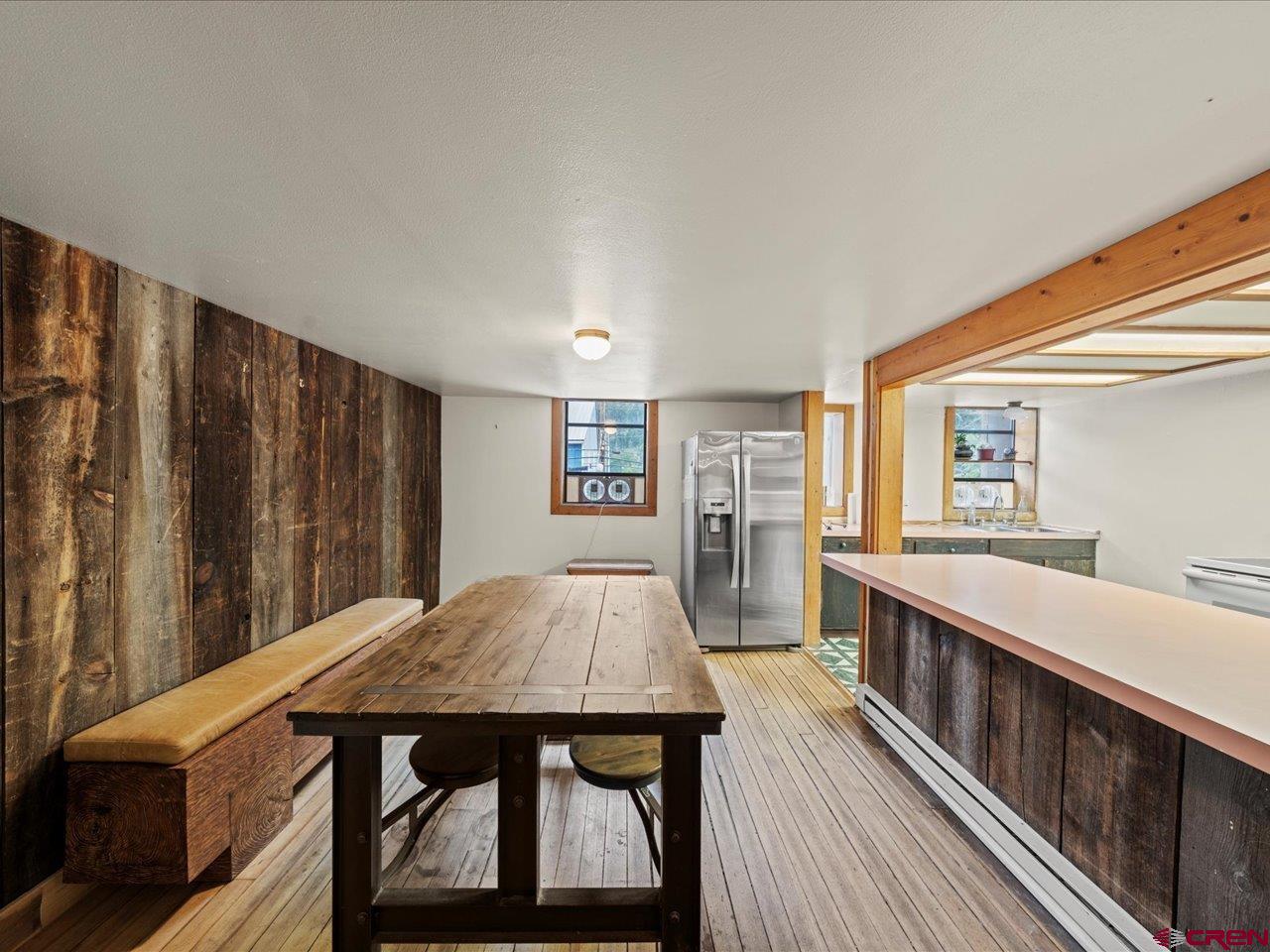 726 Main Street Ouray, CO 81427 - Photo 19 of 41 a living room with stainless steel appliances granite countertop furniture wooden floor and a window