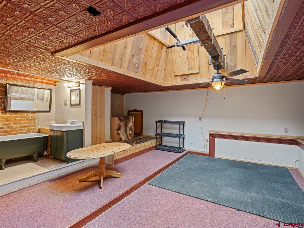 726 Main Street Ouray, CO 81427 - Photo 23 of 41 a living room with furniture a rug and a table