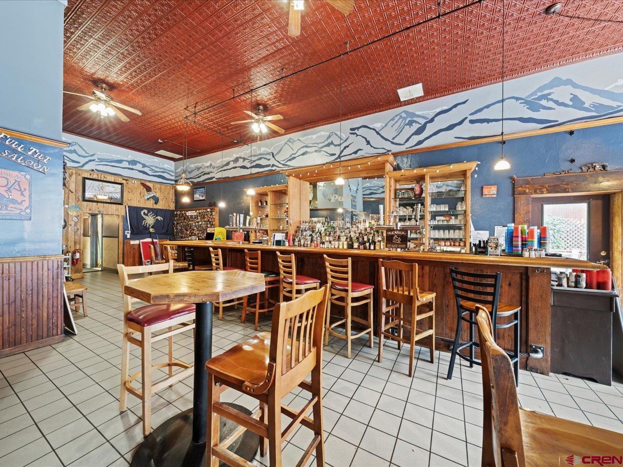 726 Main Street Ouray, CO 81427 - Photo 8 of 41 a outdoor space with lots of tables a chairs and a stove