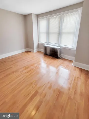 a view of gallery with wooden floor