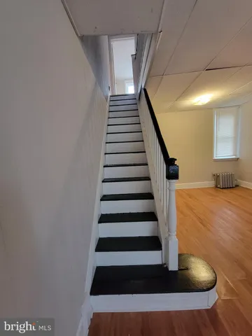 a view of a kitchen from the hallway