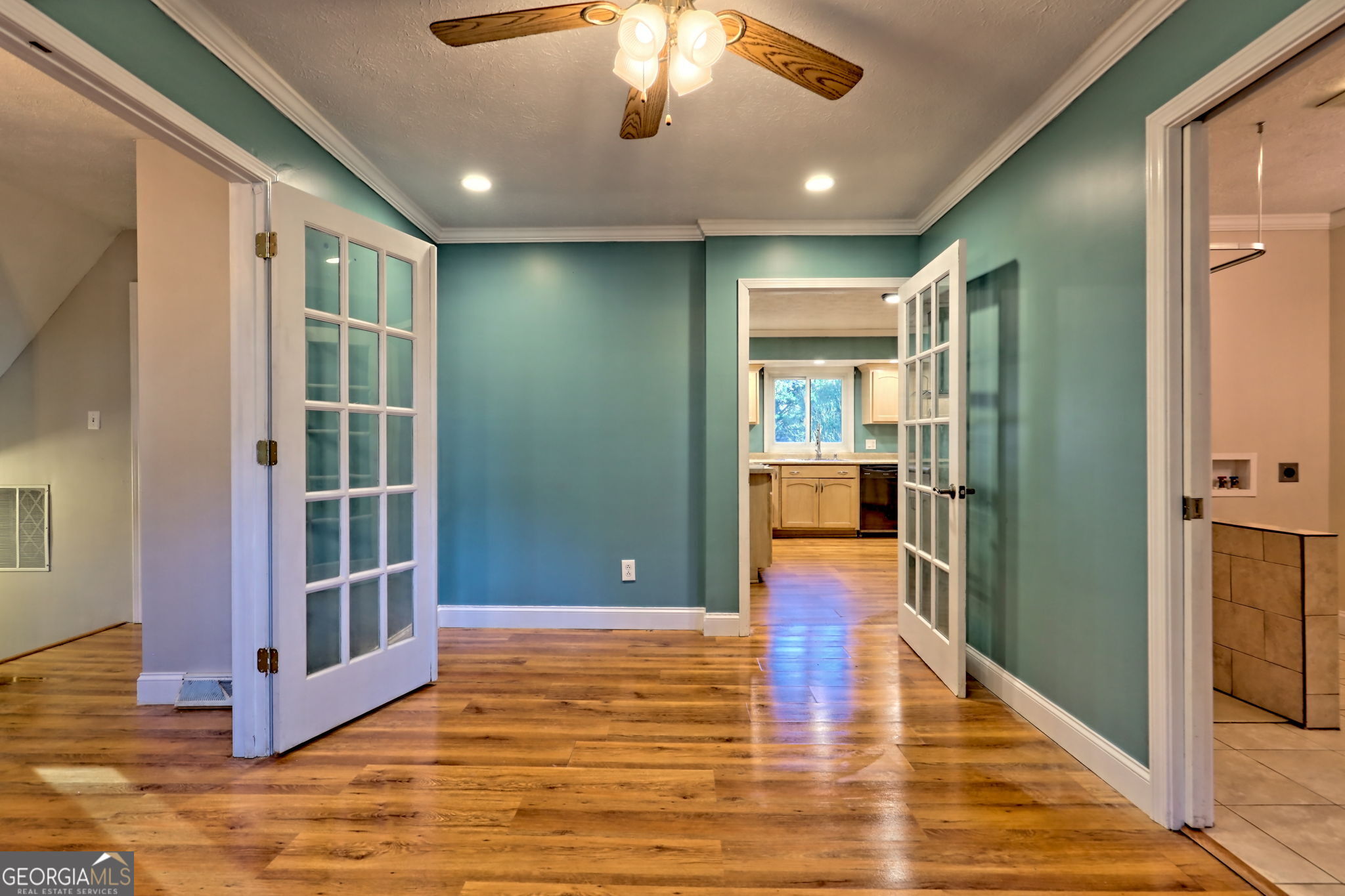 588 Estatohe Circle Toccoa, GA 30577 - Photo 12 of 71 a view of a hallway with wooden floor and a chandelier