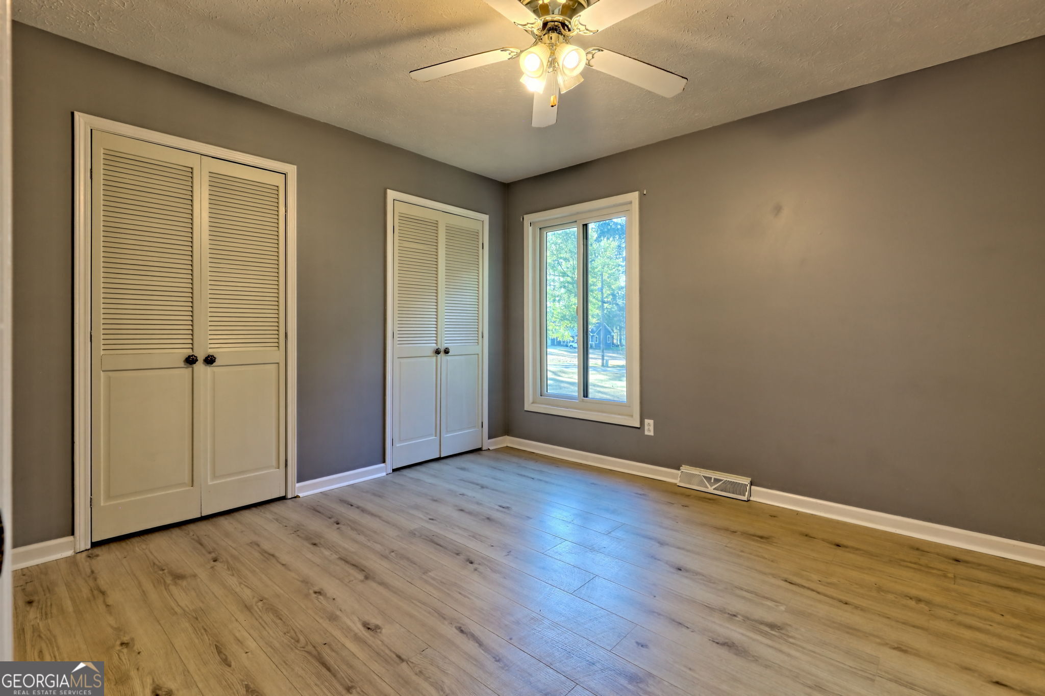 588 Estatohe Circle Toccoa, GA 30577 - Photo 24 of 71 a view of an empty room with wooden floor and a window