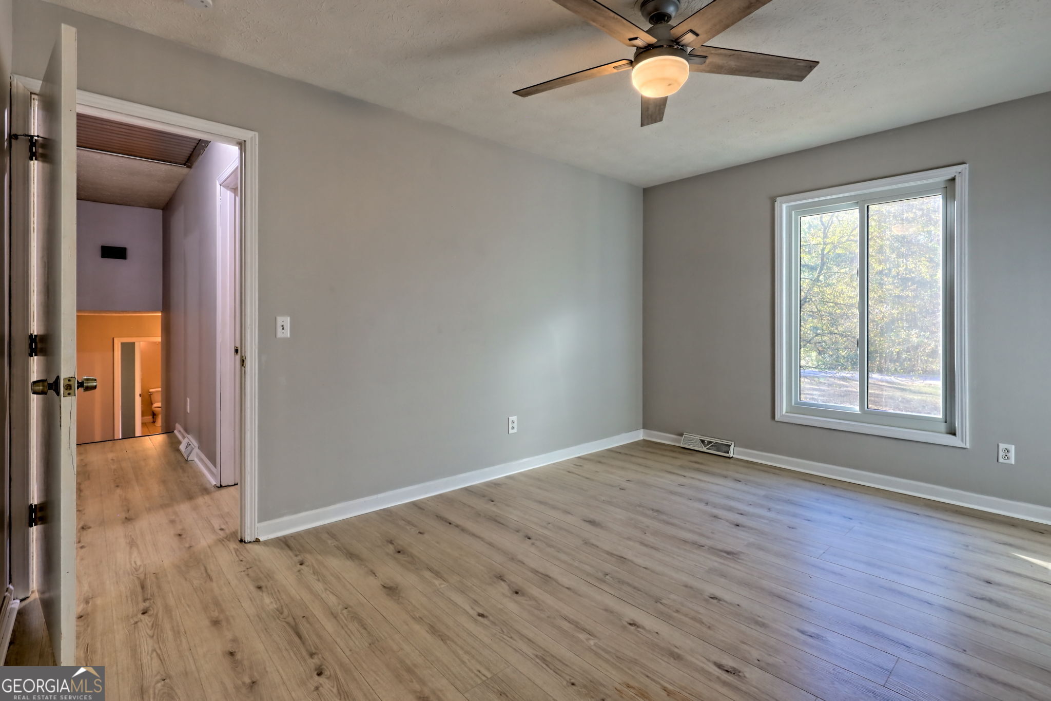 588 Estatohe Circle Toccoa, GA 30577 - Photo 28 of 71 wooden floor in an empty room with a window