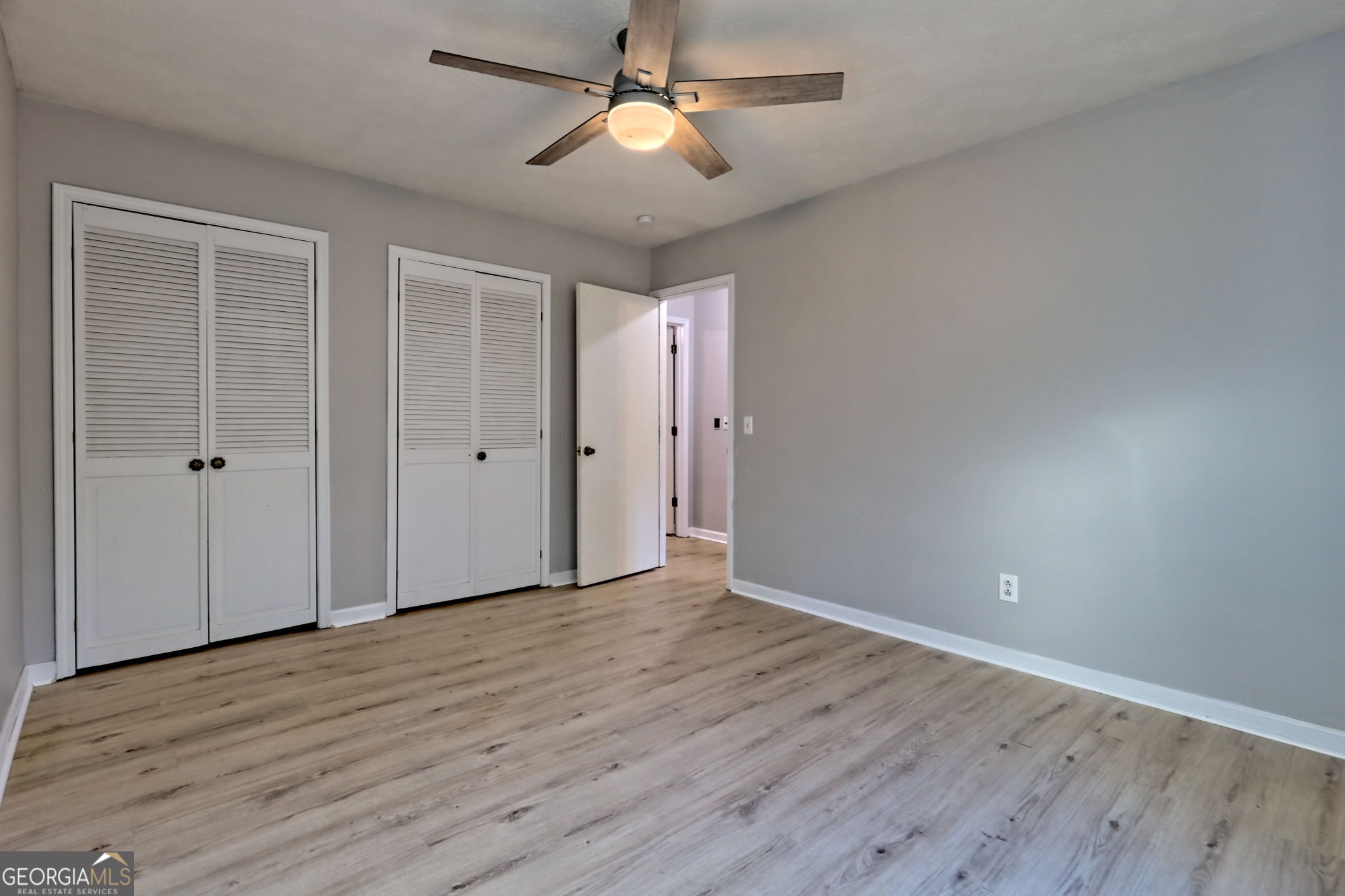 588 Estatohe Circle Toccoa, GA 30577 - Photo 29 of 71 wooden floor in an empty room with a fan