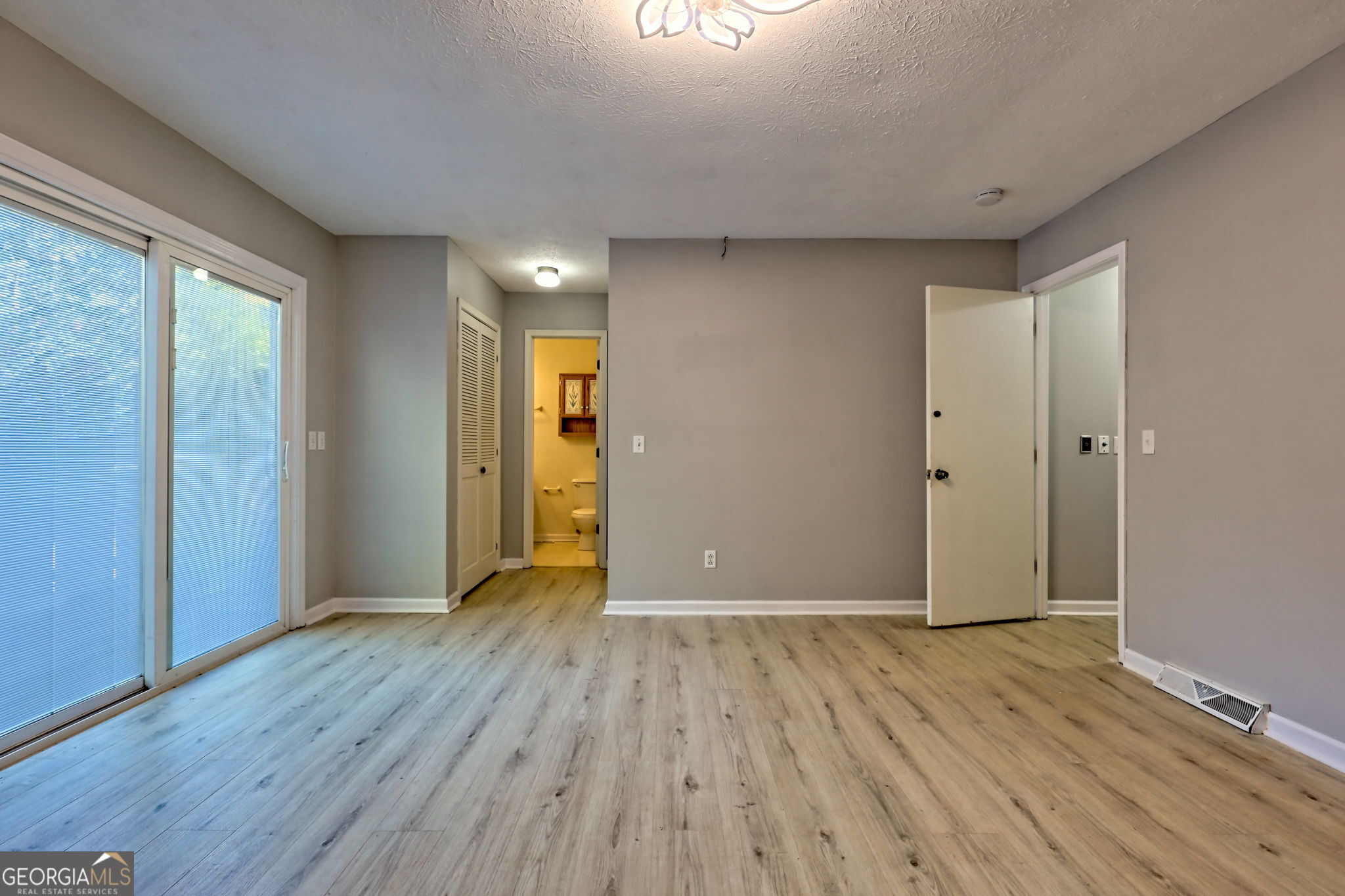 588 Estatohe Circle Toccoa, GA 30577 - Photo 31 of 71 a view of an empty room with wooden floor and a window