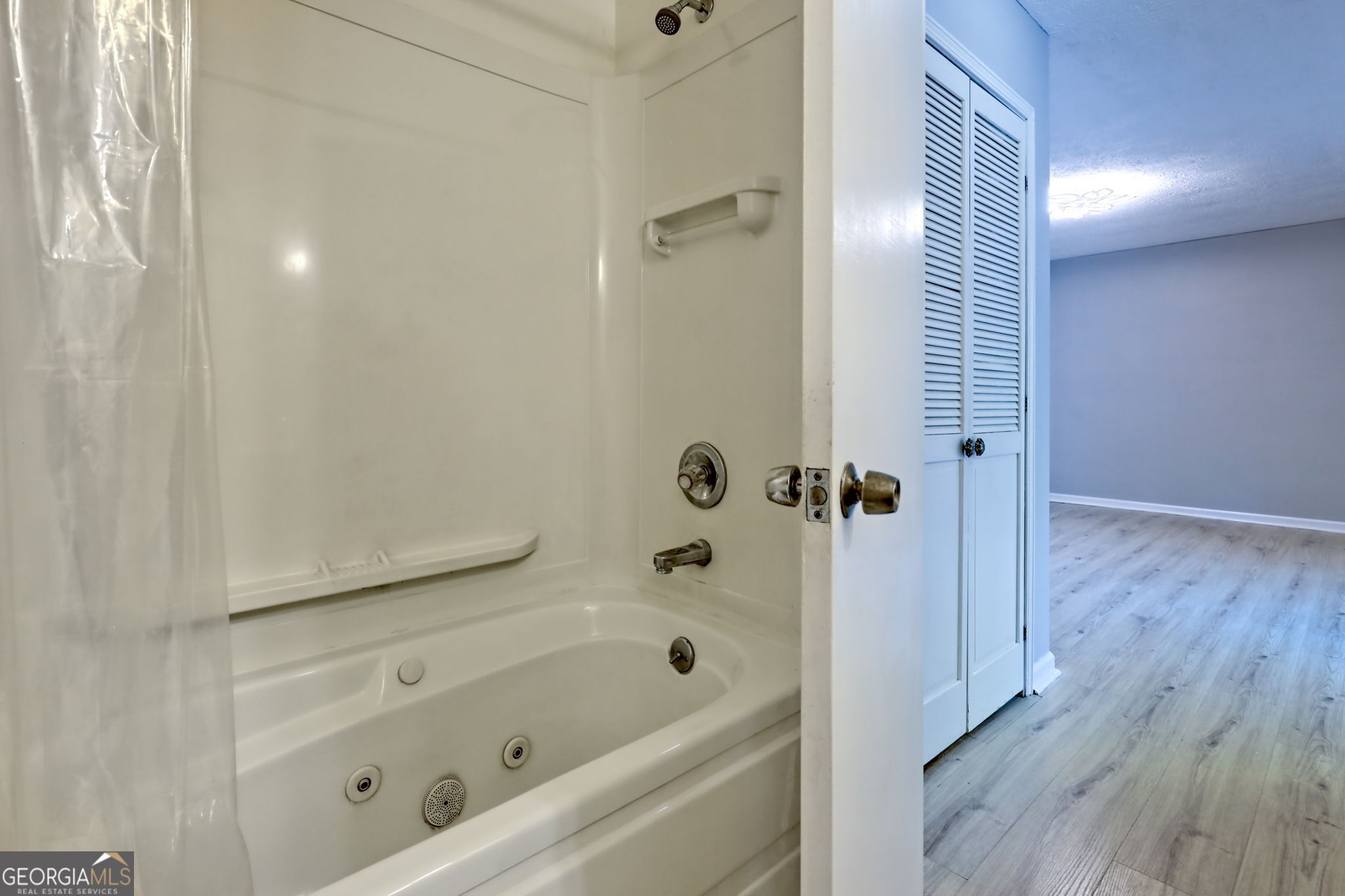 588 Estatohe Circle Toccoa, GA 30577 - Photo 34 of 71 a bathroom with a tub shower vanity and a sink