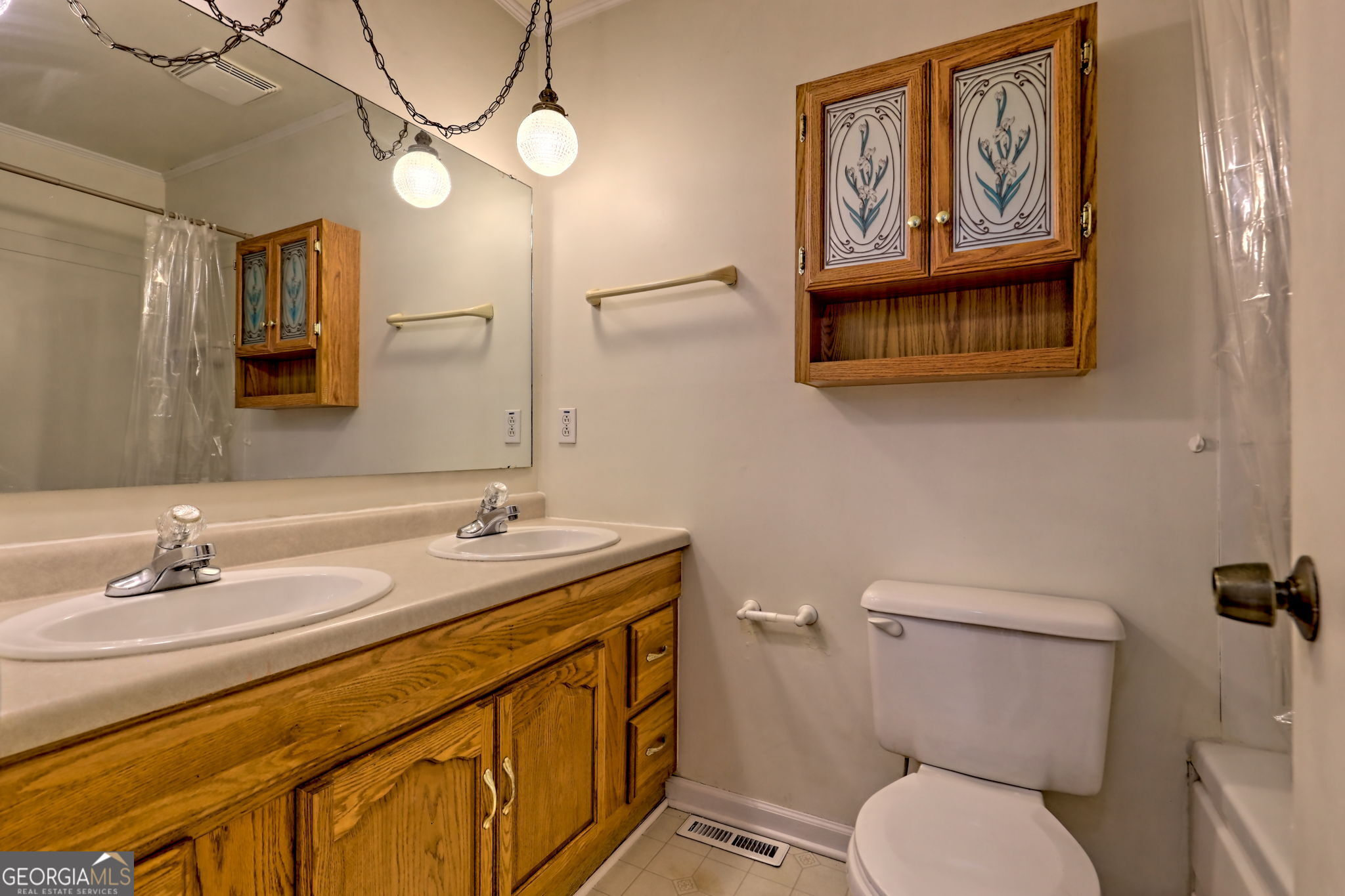 588 Estatohe Circle Toccoa, GA 30577 - Photo 35 of 71 a bathroom with a toilet a sink and mirror