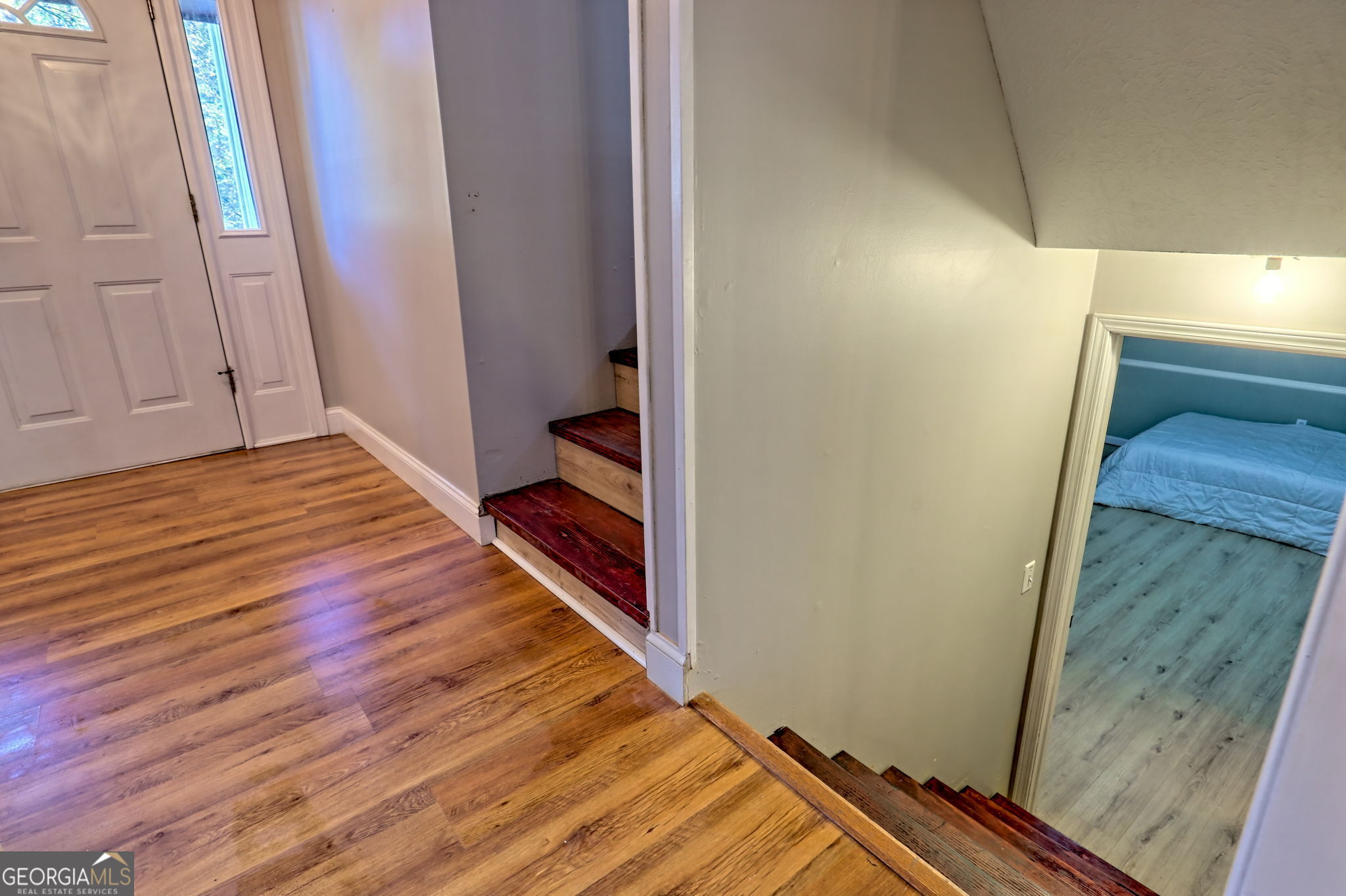 588 Estatohe Circle Toccoa, GA 30577 - Photo 43 of 71 a view of a hallway with wooden floor and staircase