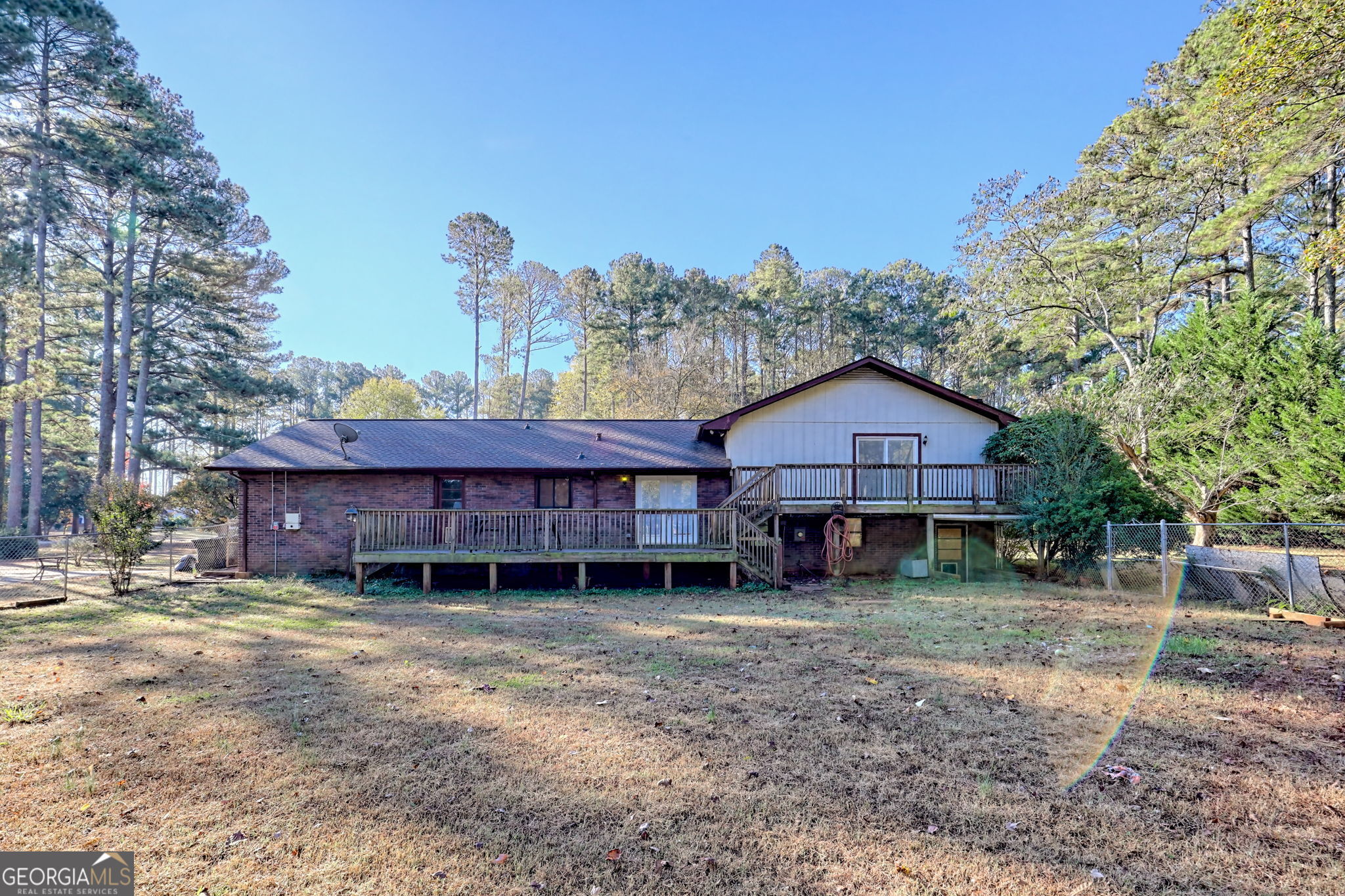 588 Estatohe Circle Toccoa, GA 30577 - Photo 52 of 71 a view of a house with a yard and wooden fence