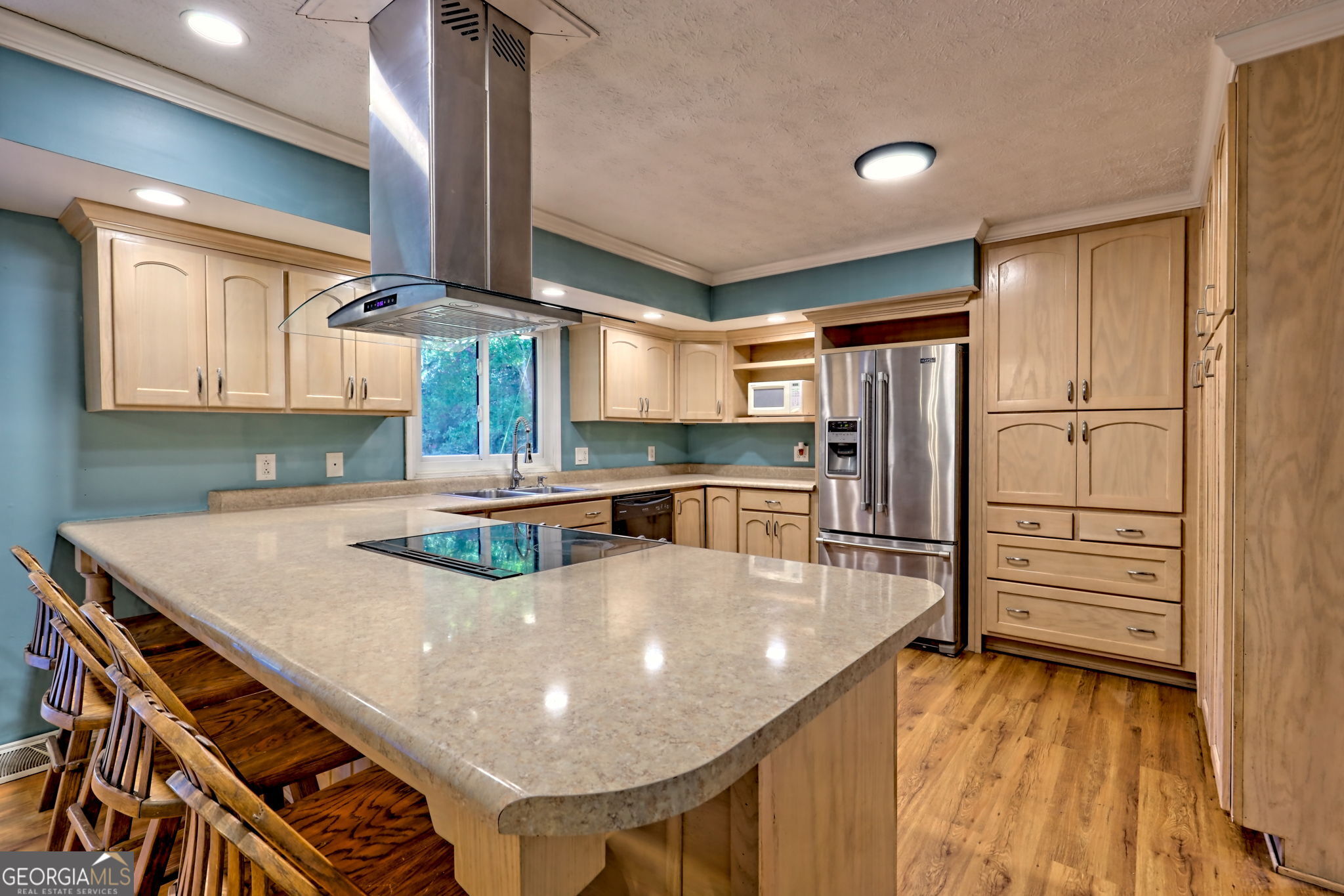 588 Estatohe Circle Toccoa, GA 30577 - Photo 7 of 71 a kitchen with stainless steel appliances granite countertop a sink a stove and a refrigerator