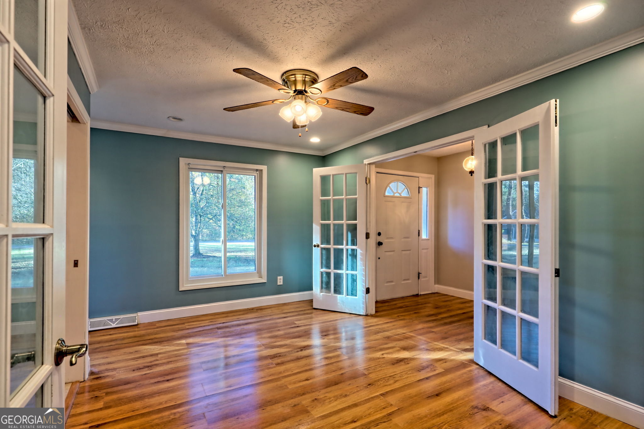 588 Estatohe Circle Toccoa, GA 30577 - Photo 10 of 71 a view of an empty room with window and wooden floor