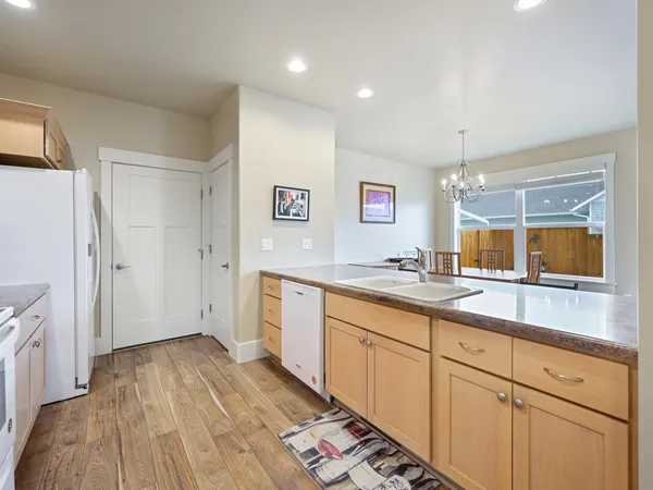 a spacious bathroom with a sink mirror and shower