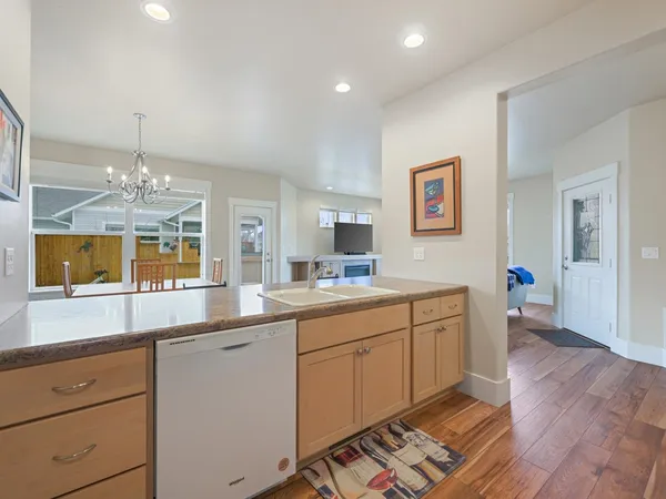 a spacious bathroom with double vanity and a mirror