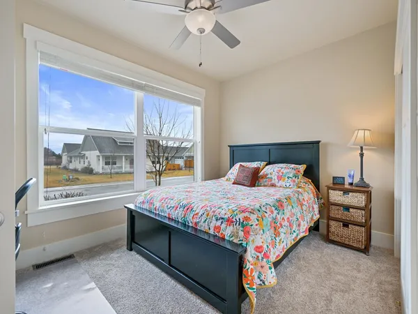 a bedroom with a bed and a window