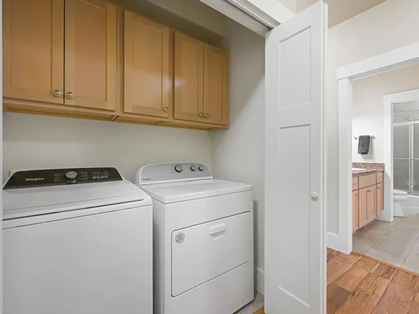 a view of storage and utility room with washer and dryer