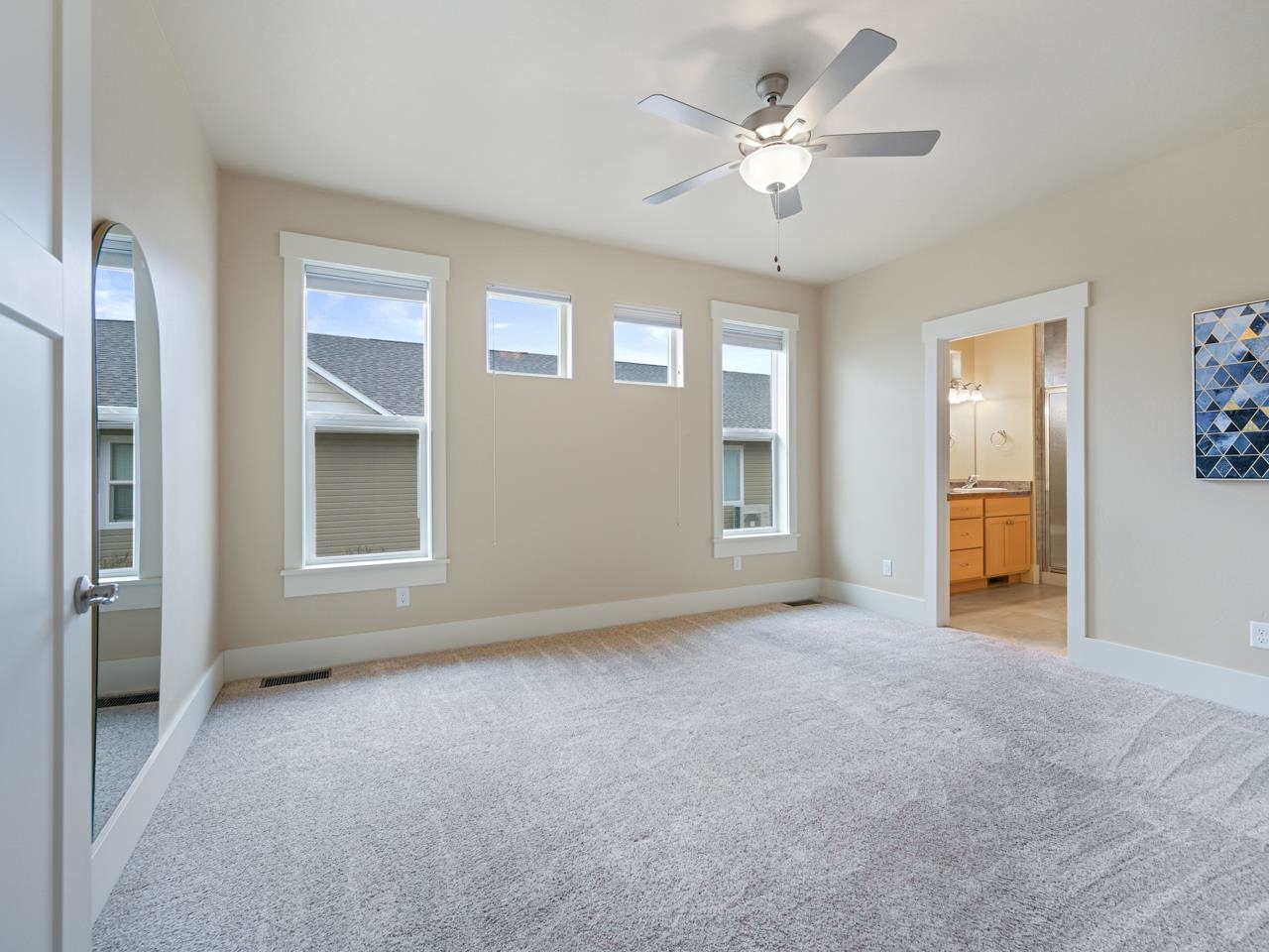 1245 Periwinkle Street Fruita, CO 81521 - Photo 23 of 34 an empty room with fan and windows