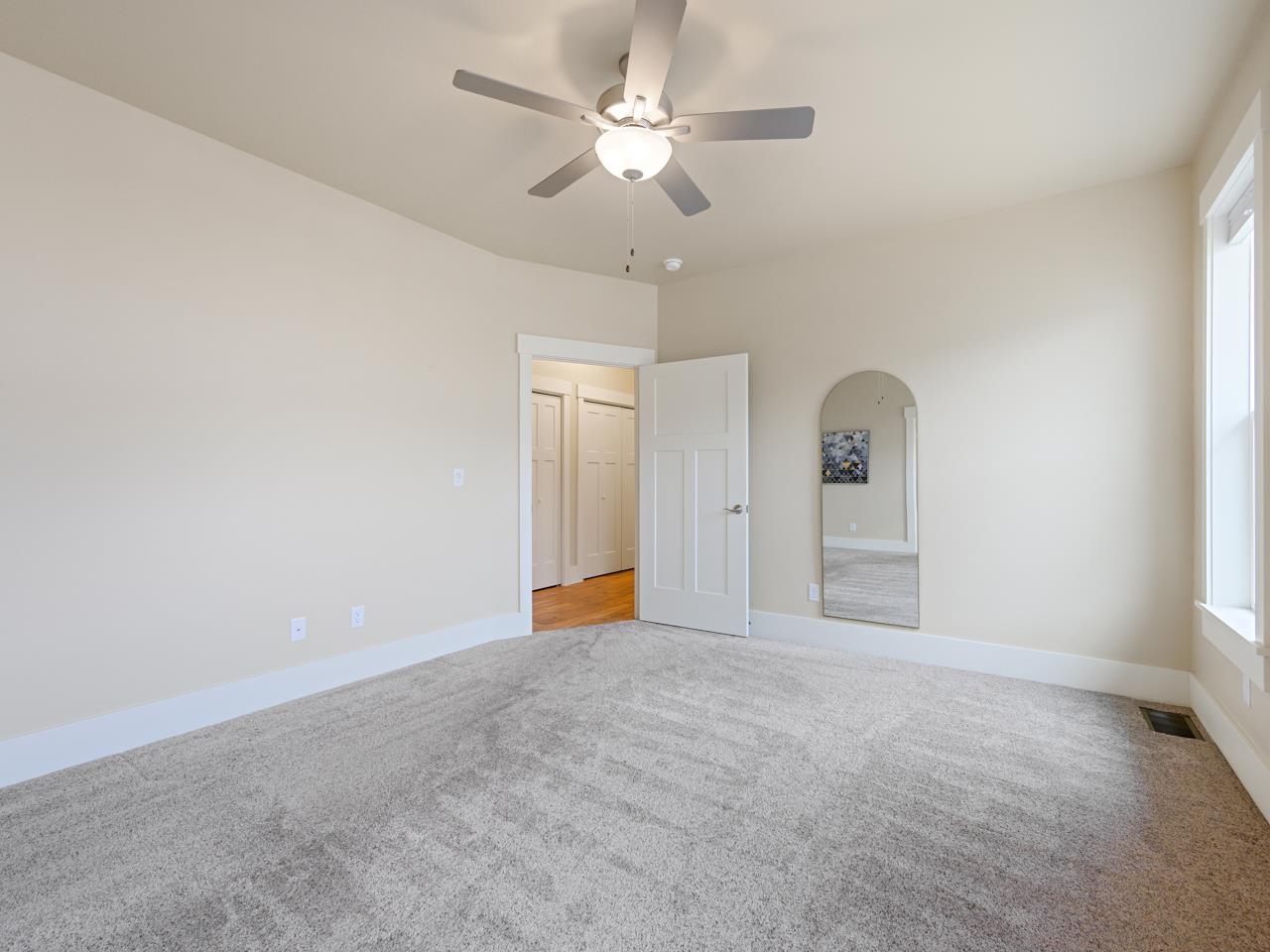 1245 Periwinkle Street Fruita, CO 81521 - Photo 25 of 34 a view of an empty room with a window