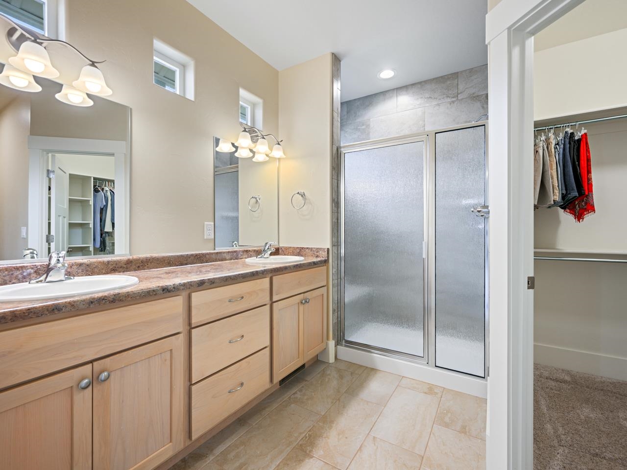 1245 Periwinkle Street Fruita, CO 81521 - Photo 26 of 34 a bathroom with a shower sink and mirror
