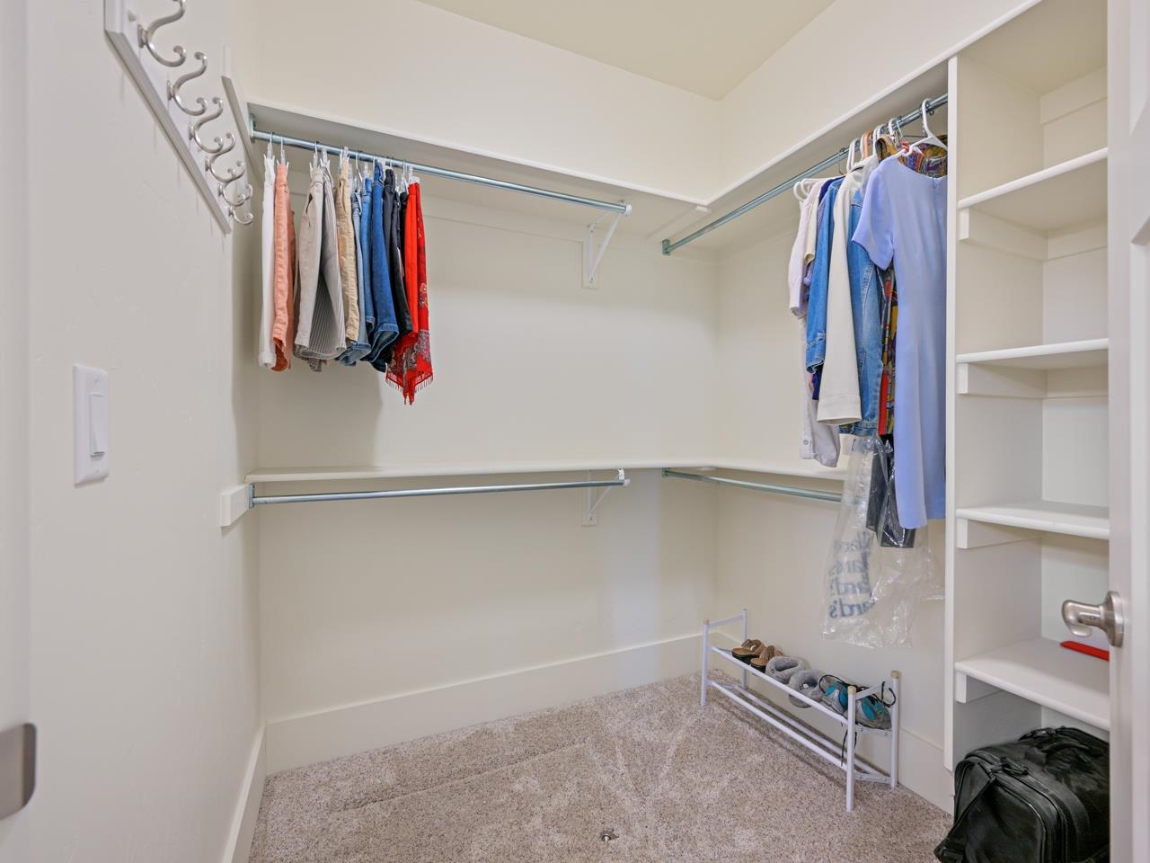 1245 Periwinkle Street Fruita, CO 81521 - Photo 28 of 34 a view of walk in closet with clothes and shoes