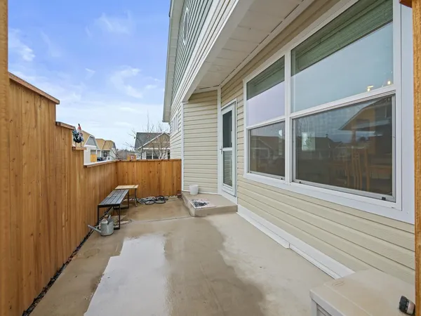 a view of a balcony with chair and front door
