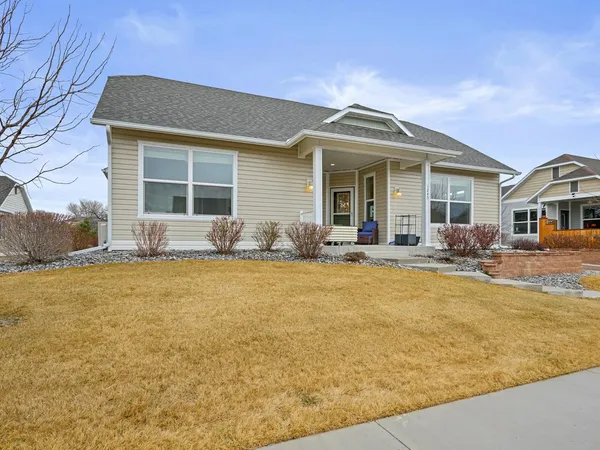 a front view of house with yard outdoor seating and barbeque oven