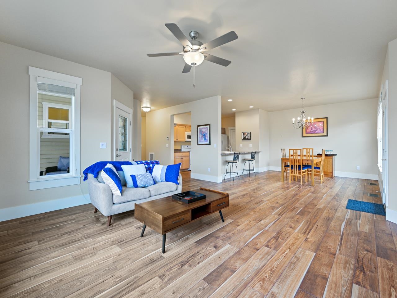 1245 Periwinkle Street Fruita, CO 81521 - Photo 4 of 34 a living room with furniture and wooden floor