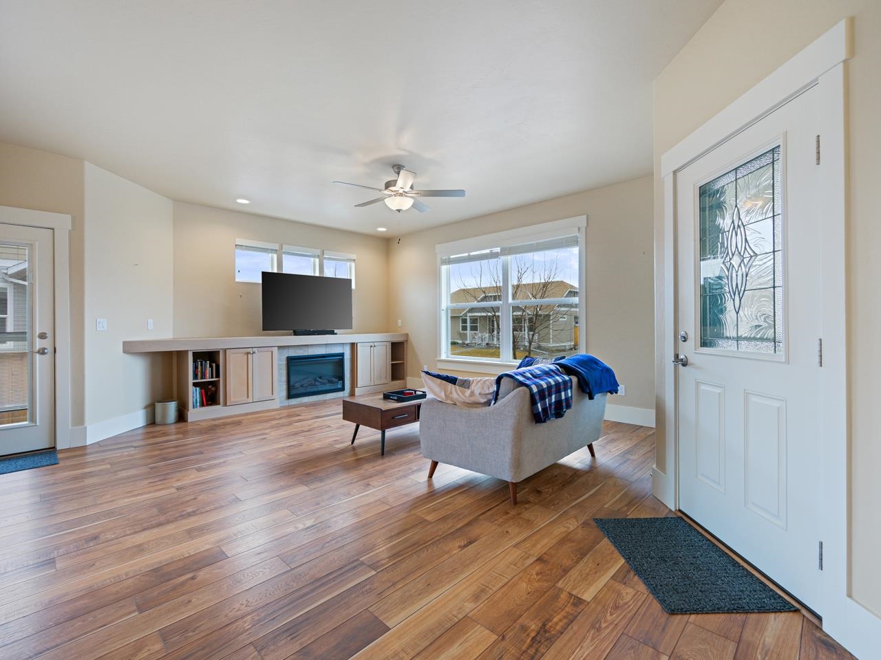 1245 Periwinkle Street Fruita, CO 81521 - Photo 6 of 34 a living room with furniture and a flat screen tv