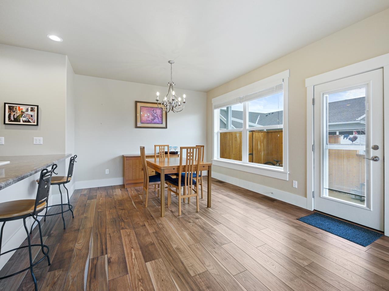 1245 Periwinkle Street Fruita, CO 81521 - Photo 7 of 34 a view of a dining room with furniture and wooden floor