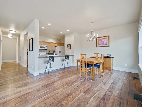 a living room with furniture and kitchen view