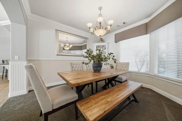 a living room with furniture and gym equipment