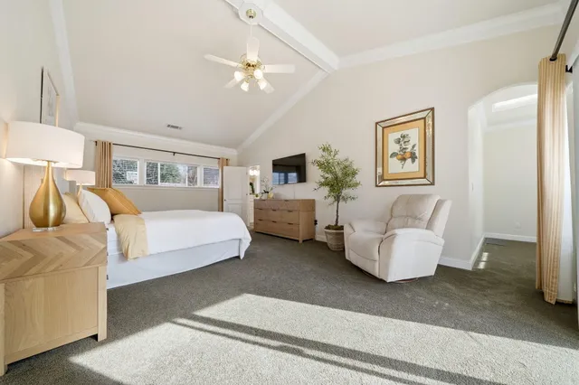 a view of a patio with a dining table and chairs with wooden floor