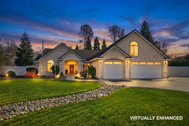 a living room with furniture a chandelier and a flat screen tv