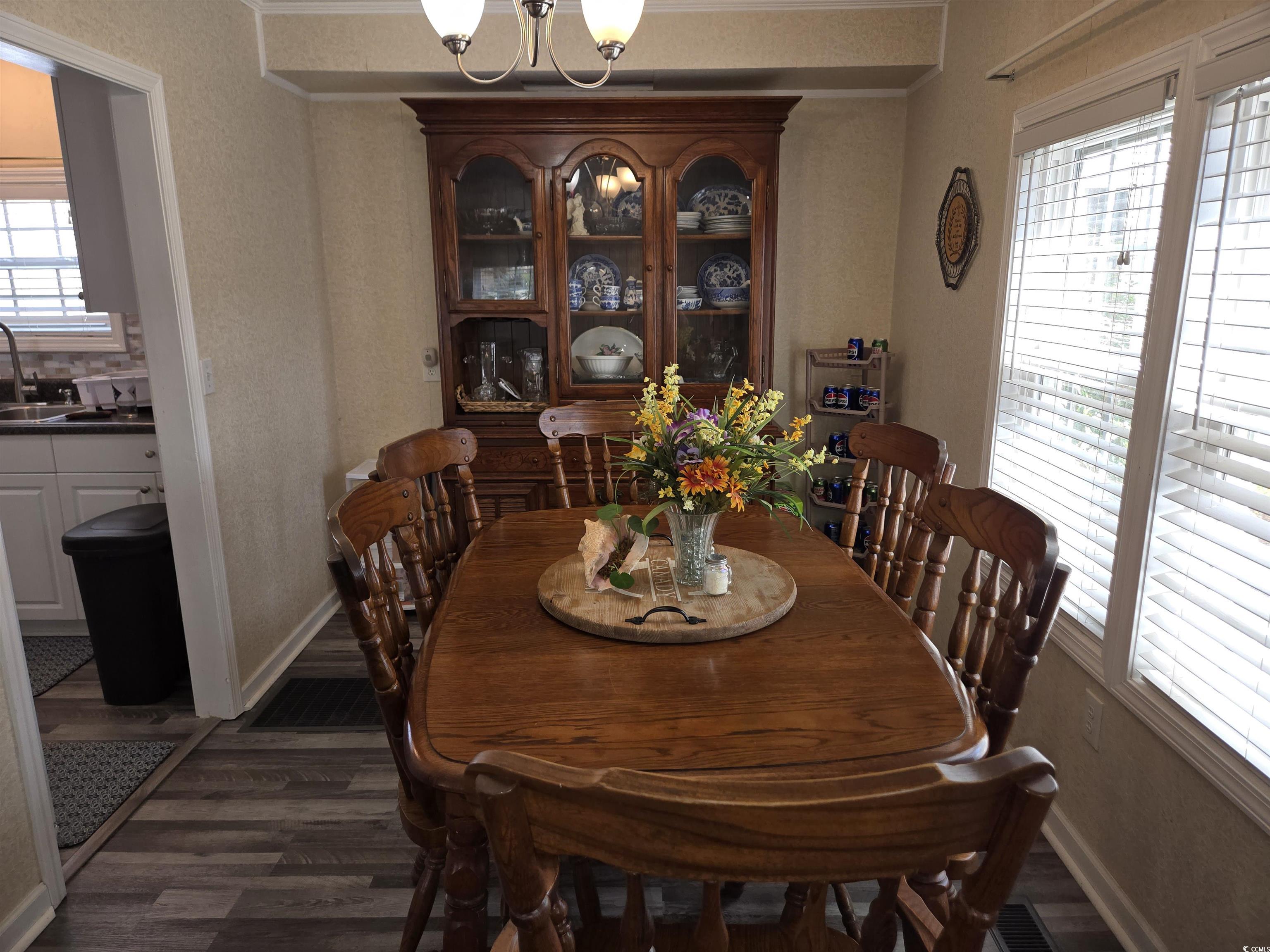 420 Delton Drive Murrells Inlet, SC 29576 - Photo 17 of 36 Dining room featuring a chandelier and dark wood-style floors