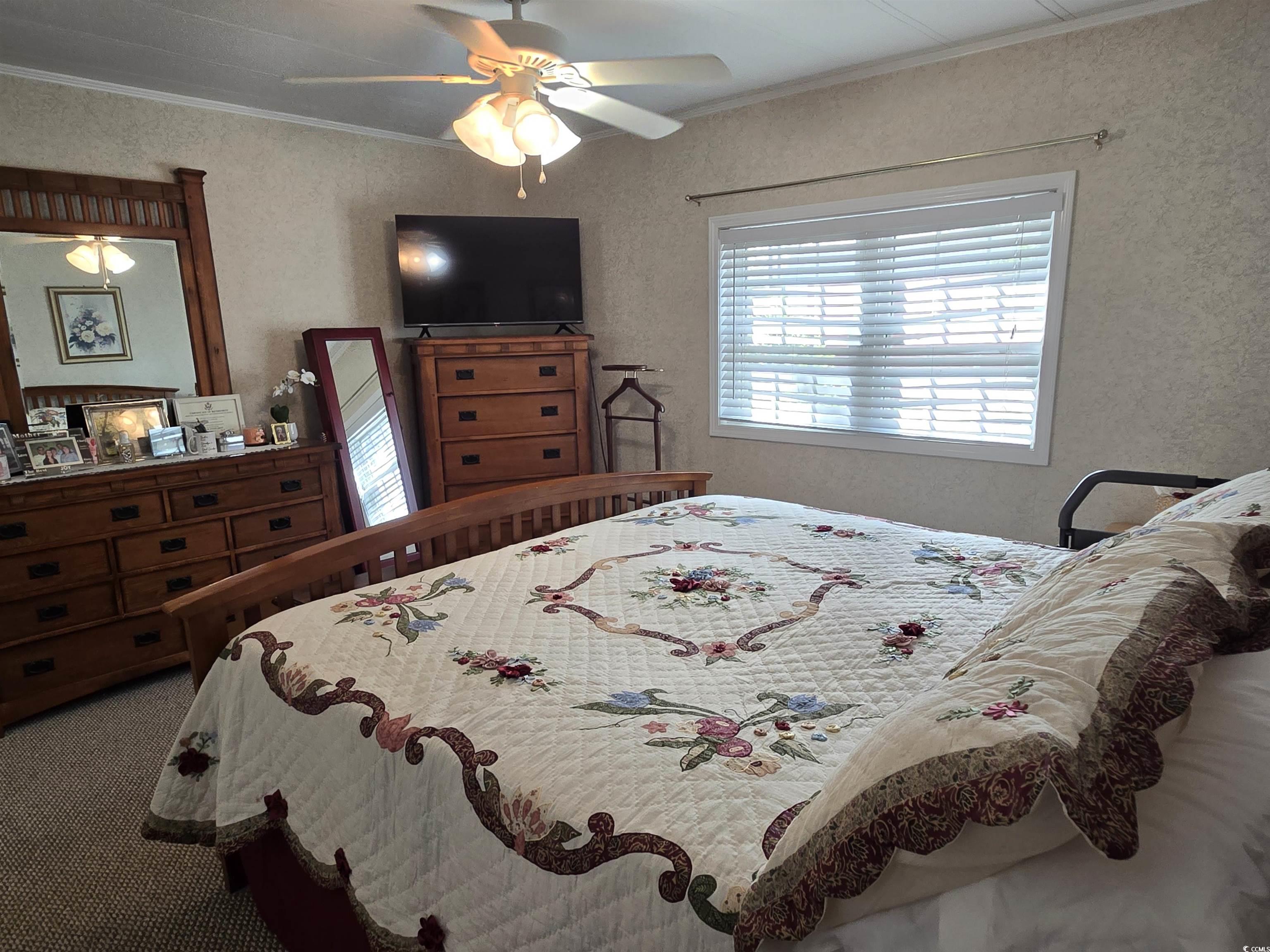 420 Delton Drive Murrells Inlet, SC 29576 - Photo 22 of 36 Carpeted bedroom featuring ornamental molding and ceiling fan