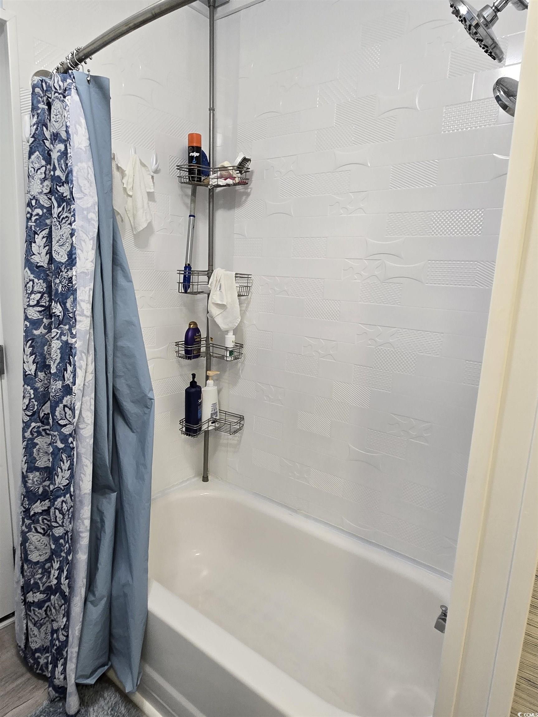 420 Delton Drive Murrells Inlet, SC 29576 - Photo 32 of 36 Bathroom featuring shower / tub combo with curtain