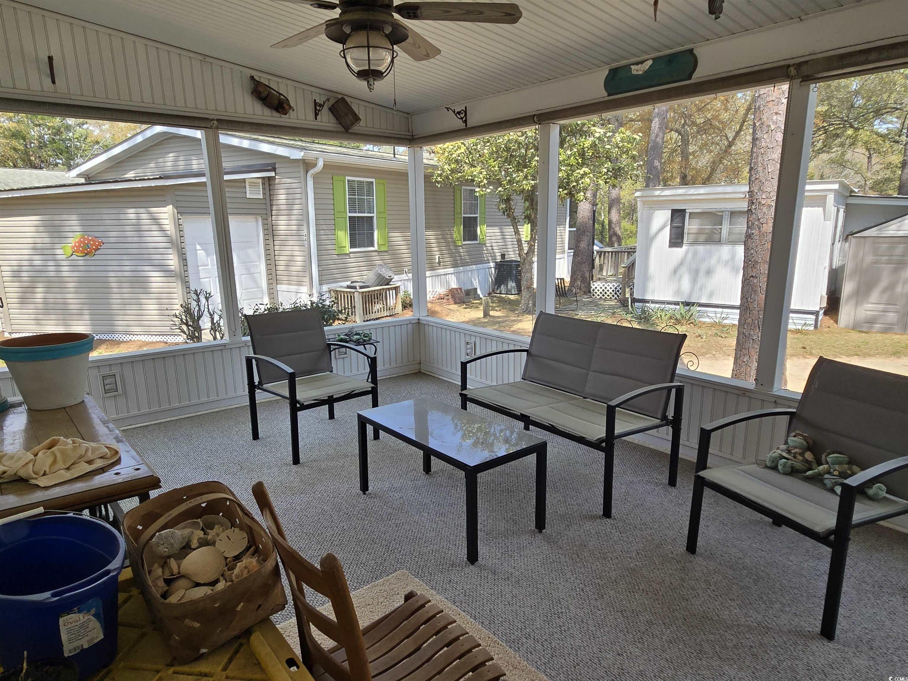 420 Delton Drive Murrells Inlet, SC 29576 - Photo 36 of 36 Sunroom / solarium with ceiling fan and an outdoor living space