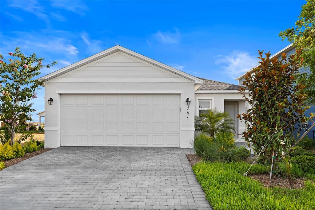a view of garage and yard