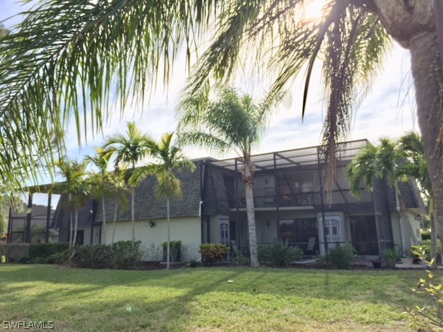 3021 Matecumbe Key Road, Unit 2 Punta Gorda, FL 33955 - Photo 1 of 24 a view of a backyard with plants