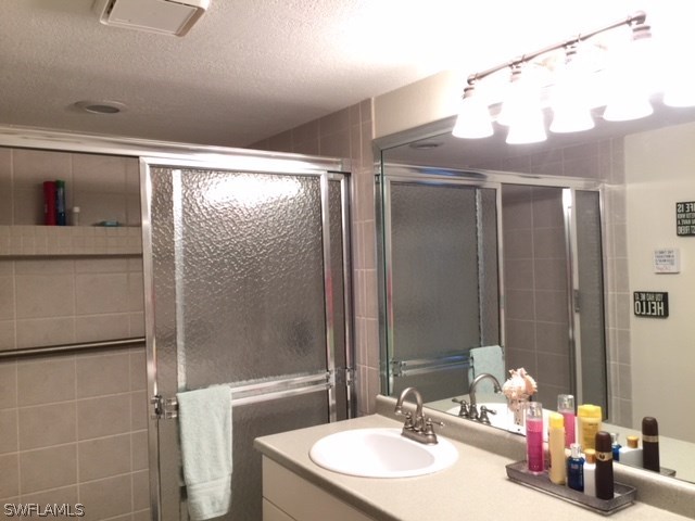 3021 Matecumbe Key Road, Unit 2 Punta Gorda, FL 33955 - Photo 16 of 24 a bathroom with a sink and a mirror