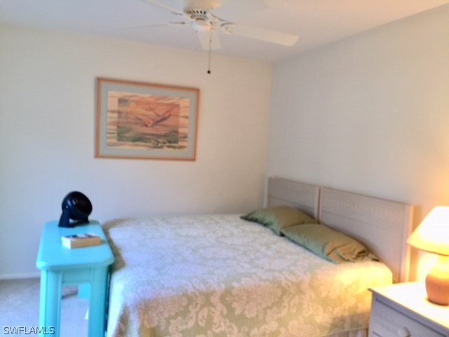 3021 Matecumbe Key Road, Unit 2 Punta Gorda, FL 33955 - Photo 18 of 24 a bedroom with a bed and a window