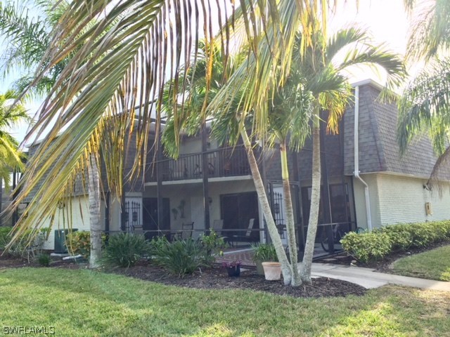 3021 Matecumbe Key Road, Unit 2 Punta Gorda, FL 33955 - Photo 2 of 24 a front view of a house with garden