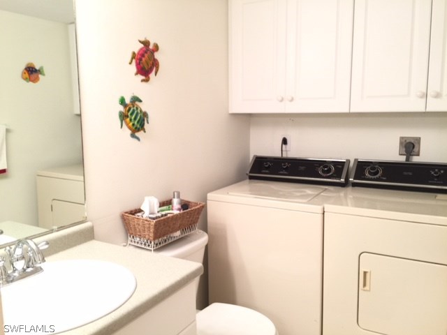 3021 Matecumbe Key Road, Unit 2 Punta Gorda, FL 33955 - Photo 22 of 24 a bathroom with a sink a toilet and vanity