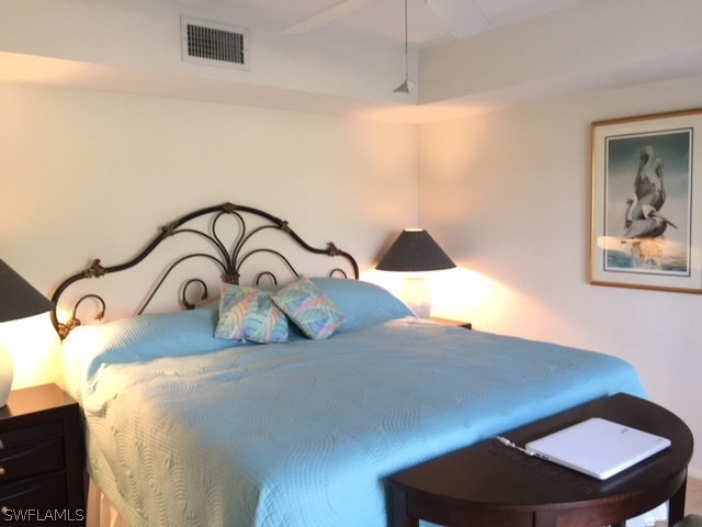 3021 Matecumbe Key Road, Unit 2 Punta Gorda, FL 33955 - Photo 23 of 24 a bedroom with a bed and a dresser