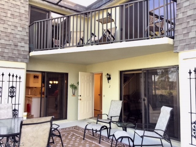 3021 Matecumbe Key Road, Unit 2 Punta Gorda, FL 33955 - Photo 3 of 24 a view of a patio with table and chairs and potted plants