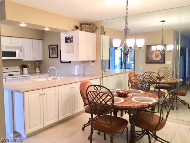 3021 Matecumbe Key Road, Unit 2 Punta Gorda, FL 33955 - Photo 10 of 24 a view of a dining room with furniture