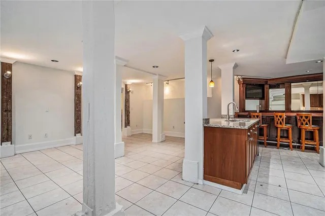 a view of a kitchen with a large window and furniture