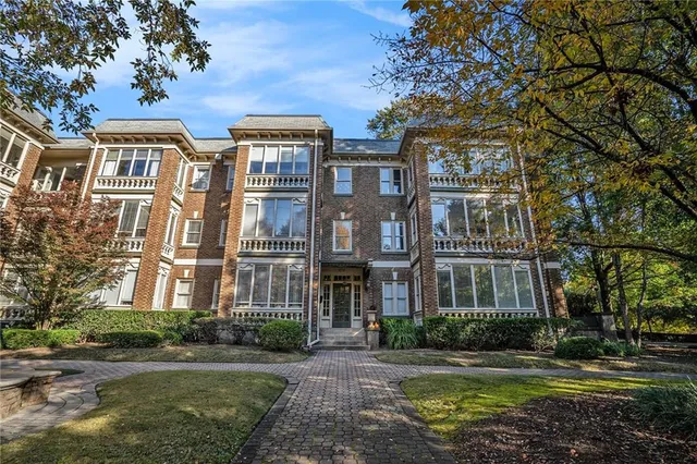 a front view of a building with lot of windows