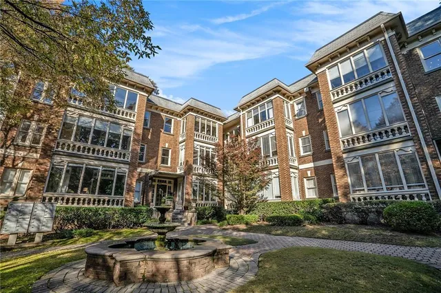 a building view with swimming pool in front of it